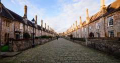 Straight path and houses with chimneys