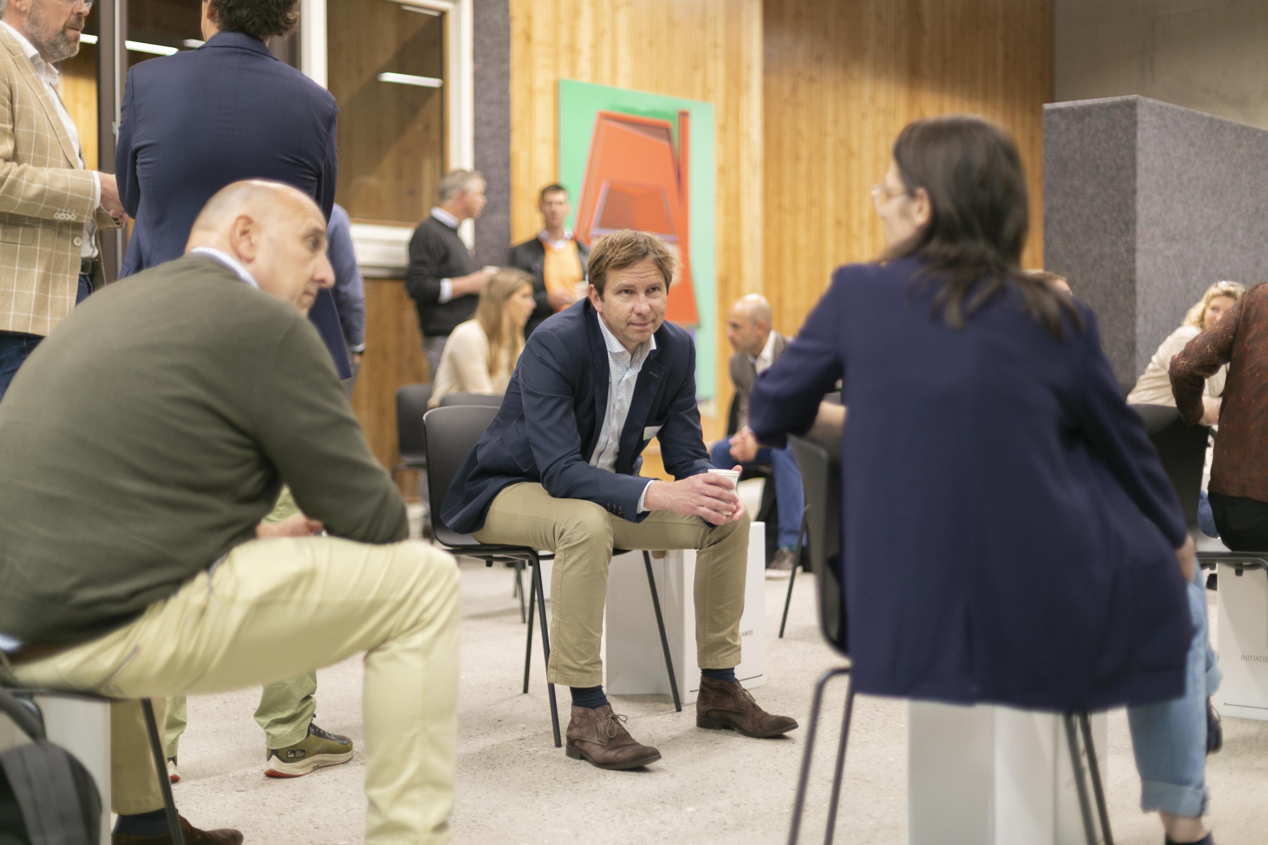 People talking at a Co-financing our Future event in Amsterdam in 2020