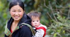 Smiling woman supported by Women Livelihood Bond